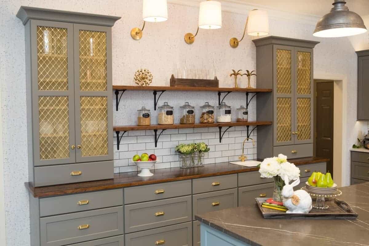 A kitchen space with metal mesh kitchen cabinets.