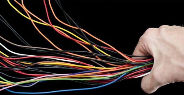 a bunch of colourful electrical wires in a hand