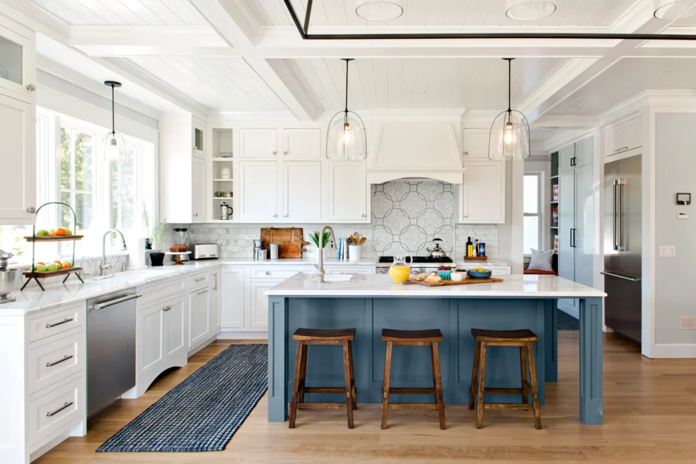 white and blue island centered kitchen