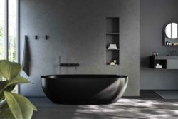 black coloured coloured bathtub in a luxury bathroom with grey walls