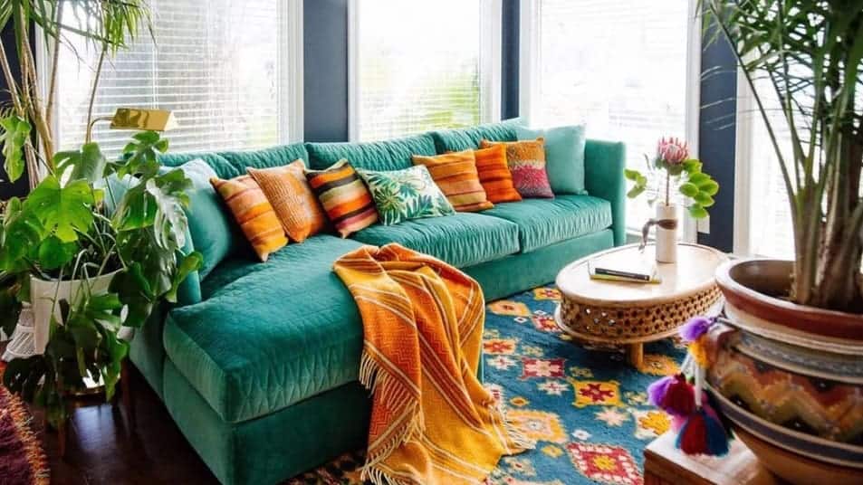 teal couch in colourful living room