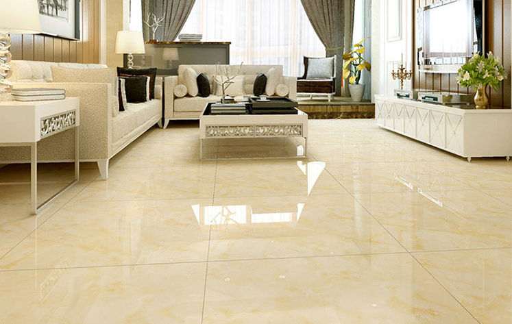 beige tiles in a living rooom with sofa and table KAG tiles catalogue designs and price list