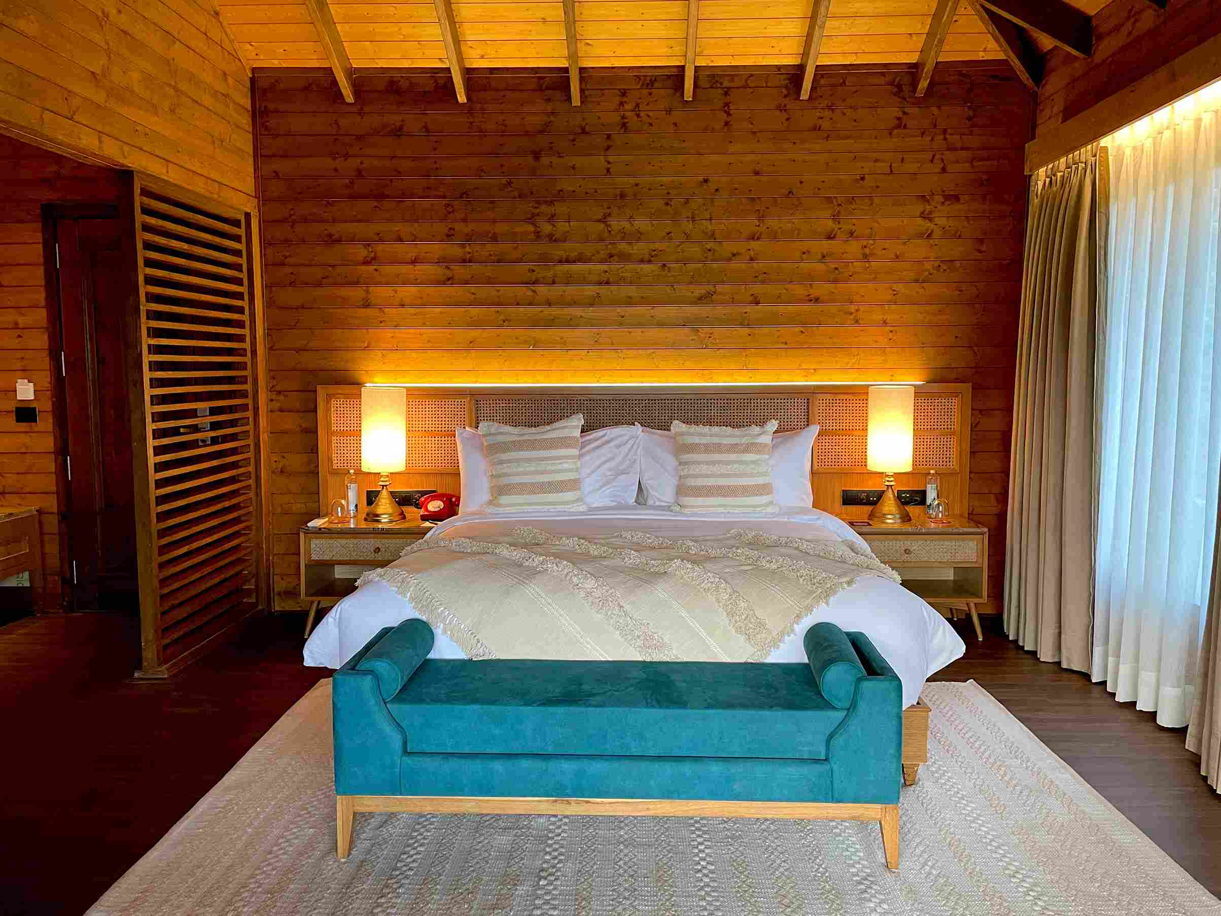 bedroom interior design of a wooden eco house in netravali, goa