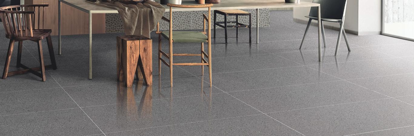 grey floors in a cafe with chairs and table