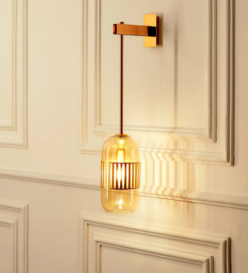 one light armed fixture, with modern touch, made of brass metal and glass, antique brass finish