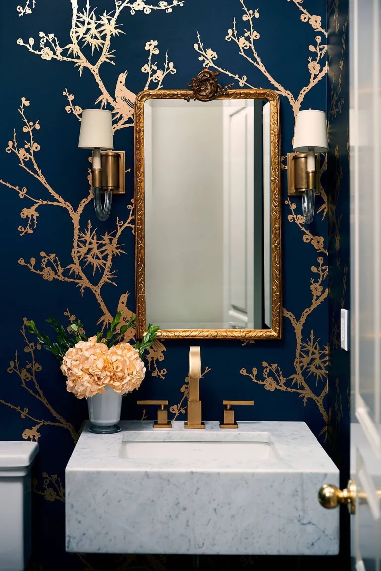 beautiful design on bathroom wall, beautiful compact restroom, mirror, wall sconce
