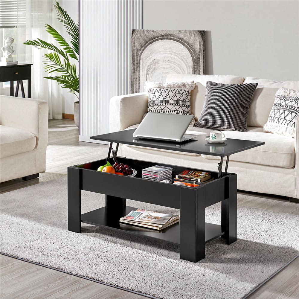 lift top centre piece, beige sofa, cu،ons, carpet , white walls, storage under and within the centre piece , ،e for laptop on the top, magazines, books