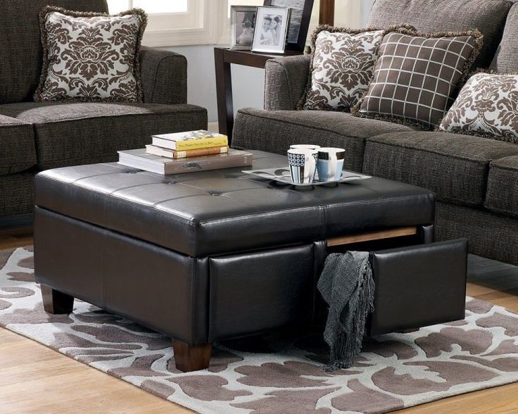 ottoman coffee table with storage, leather ottoman coffee table, books, black leather, sofa, cushions, coffee mug, rugged carpet