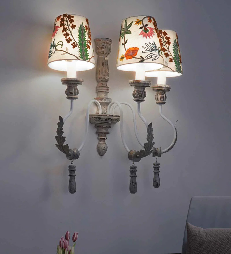 beautiful curved arms, with carvings and iron leaves, beautiful embroidered sconce