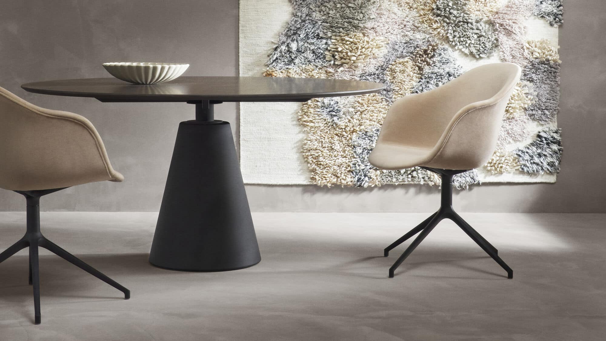 beige coloured swivel leather chair, placed in hall, coffee table in the centre, rug placed on the floor