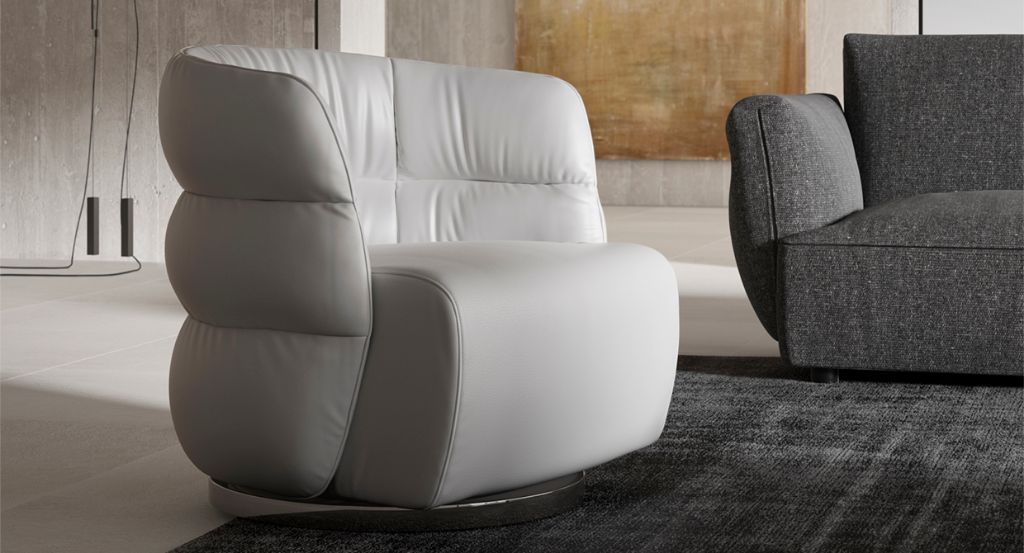 off white leather club chair with swivel function, placed in a modern living room, rug placed on the floor