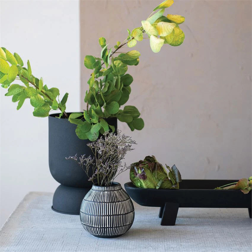 beautiful indoor planters made of stone, black and white, with hanging