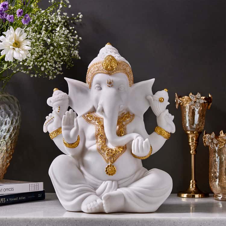 divine flair to your space with this Ganesha figurine. Made from polyresin, beautiful intricate golden decoration for ornaments