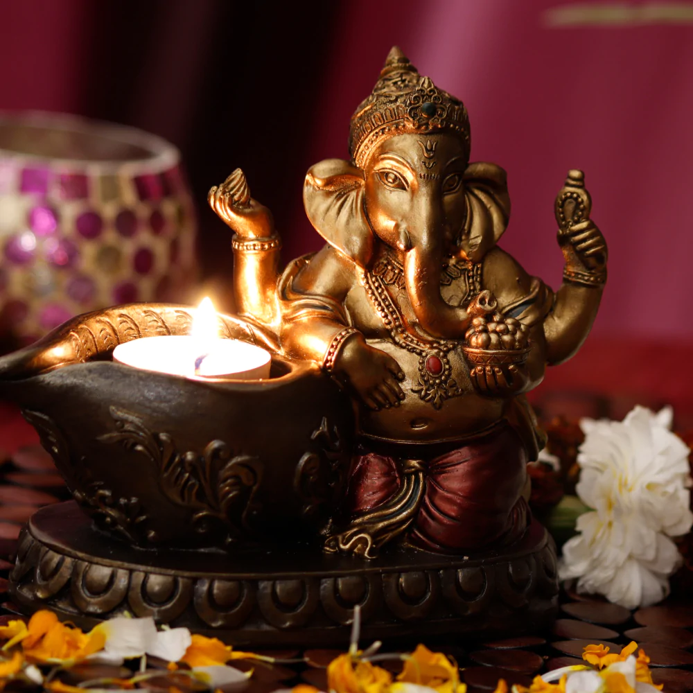 Ganesha figurine made of metal, with tealight candle holder adding beautiful decoration to the house