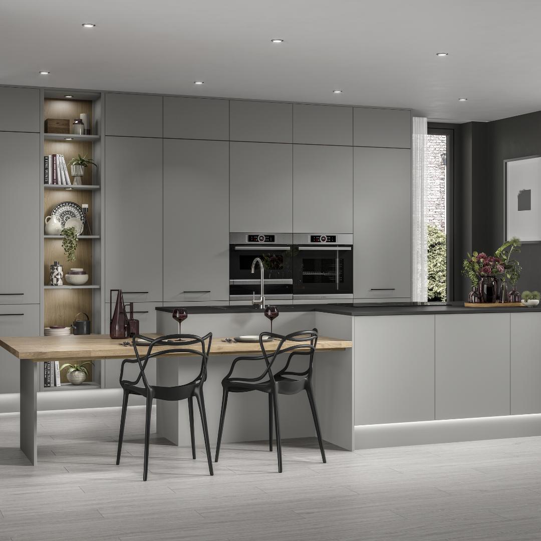 grey kitchen with black appliances kitchen island, chair and table