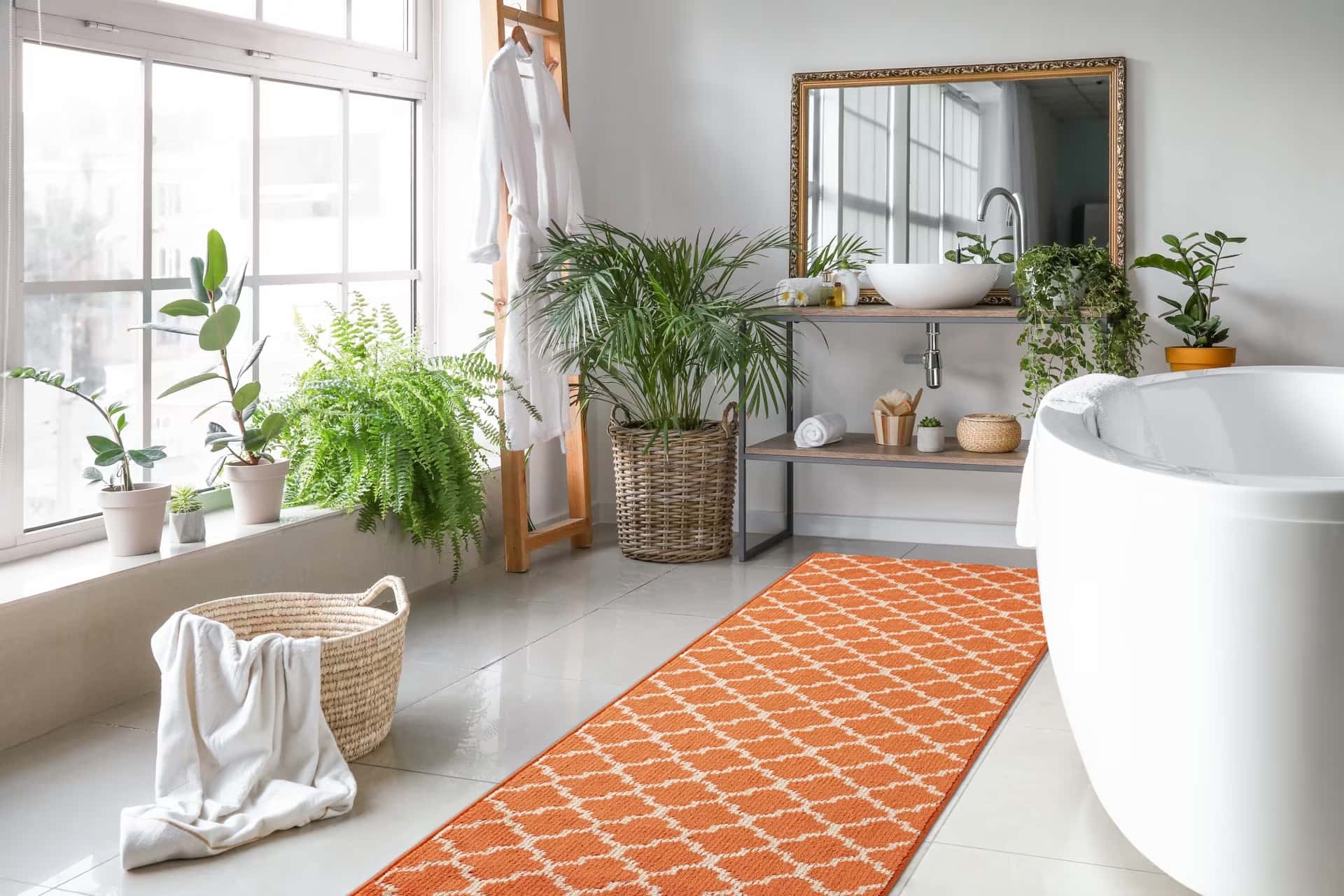 orange coloured printed carpet for bathroom, all white bathroom with a biophilic touch, planters, mirror