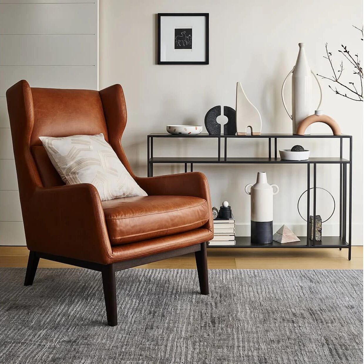 club chair made of leather, carpet placed on floor, side table, beautiful living room