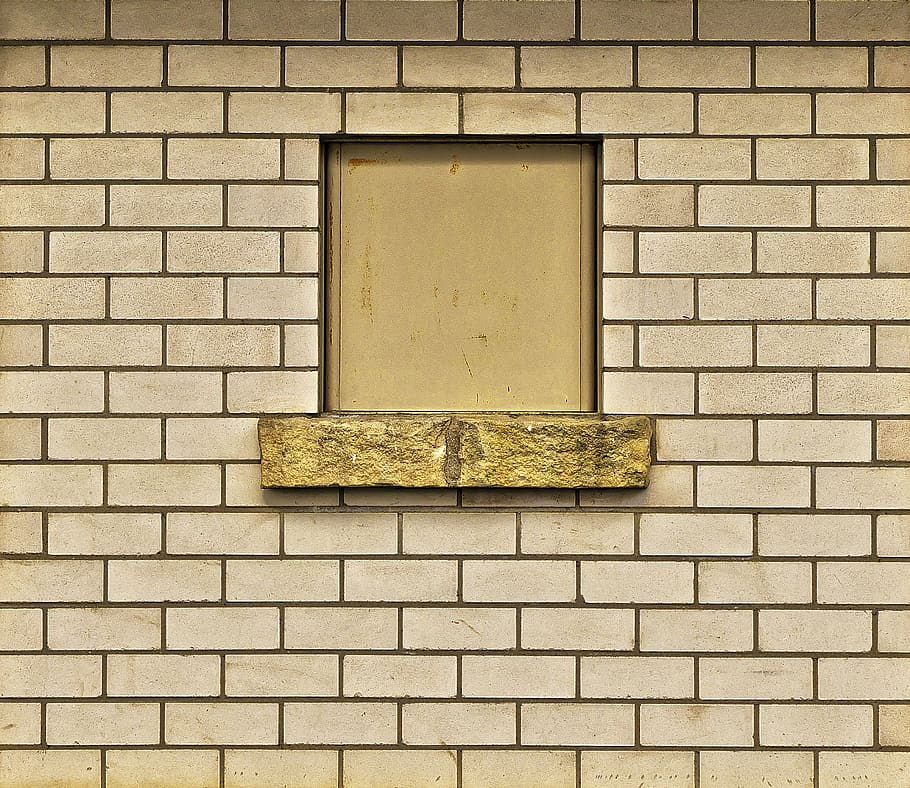 yellow fly ash bricks type in standard dimensions used for making wall with a window