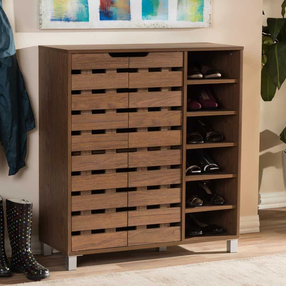 wooden shoe organiser, simple design, placed in the entryway, footwear placed inside, painting hanging above the furniture