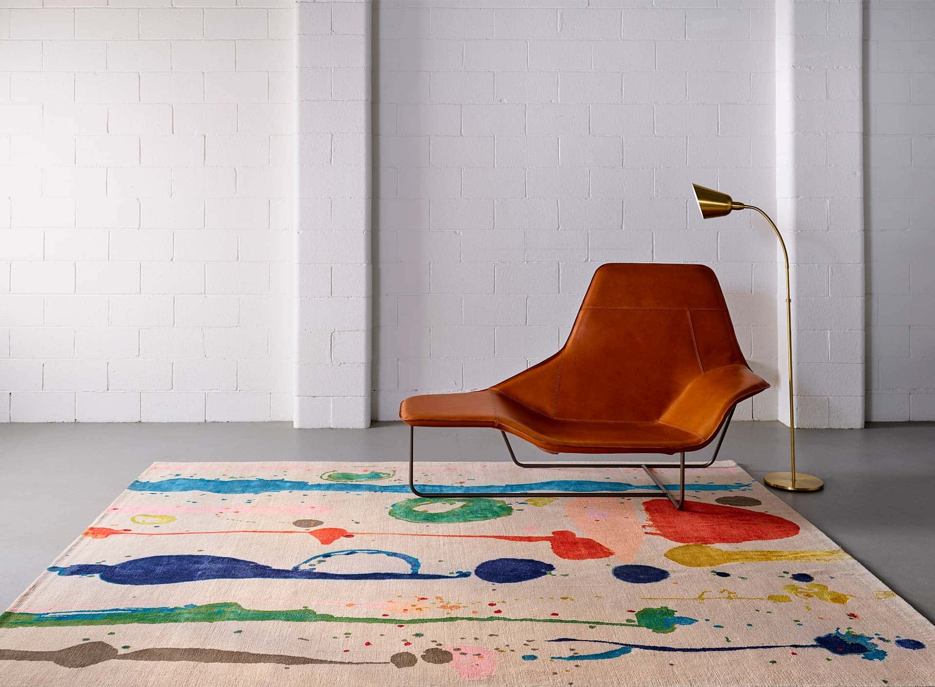 jute carpet, colourful spots on carpet, placed in a hall, orange coloured chair placed on it , side lamp, rugs for living room, outdoor rugs for decks