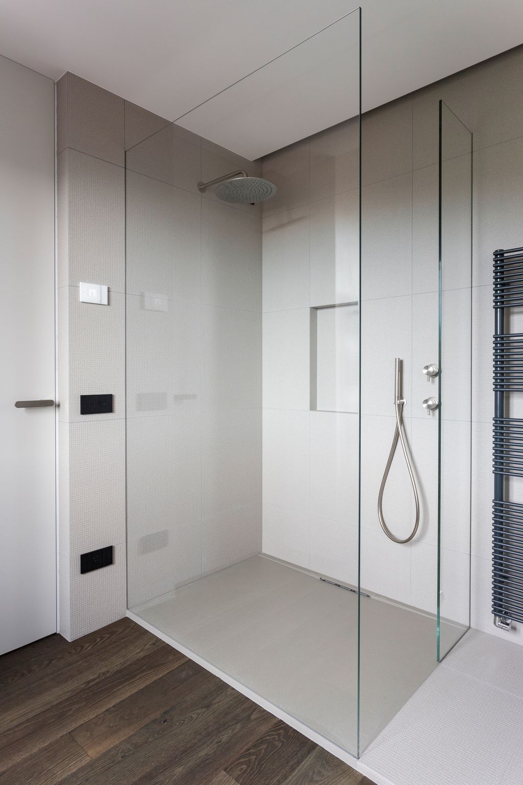 a simple bathroom with a minimal texture and a shower.
