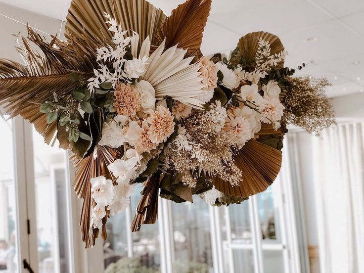 fake florals, leaves in rustic ceiling decor