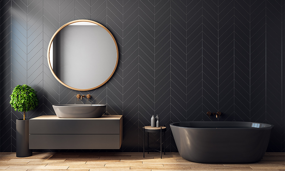 black tiled texture in the bathroom along with a mirror.