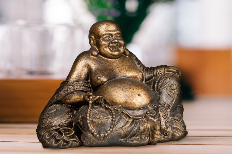 Laughing Buddha with pearls