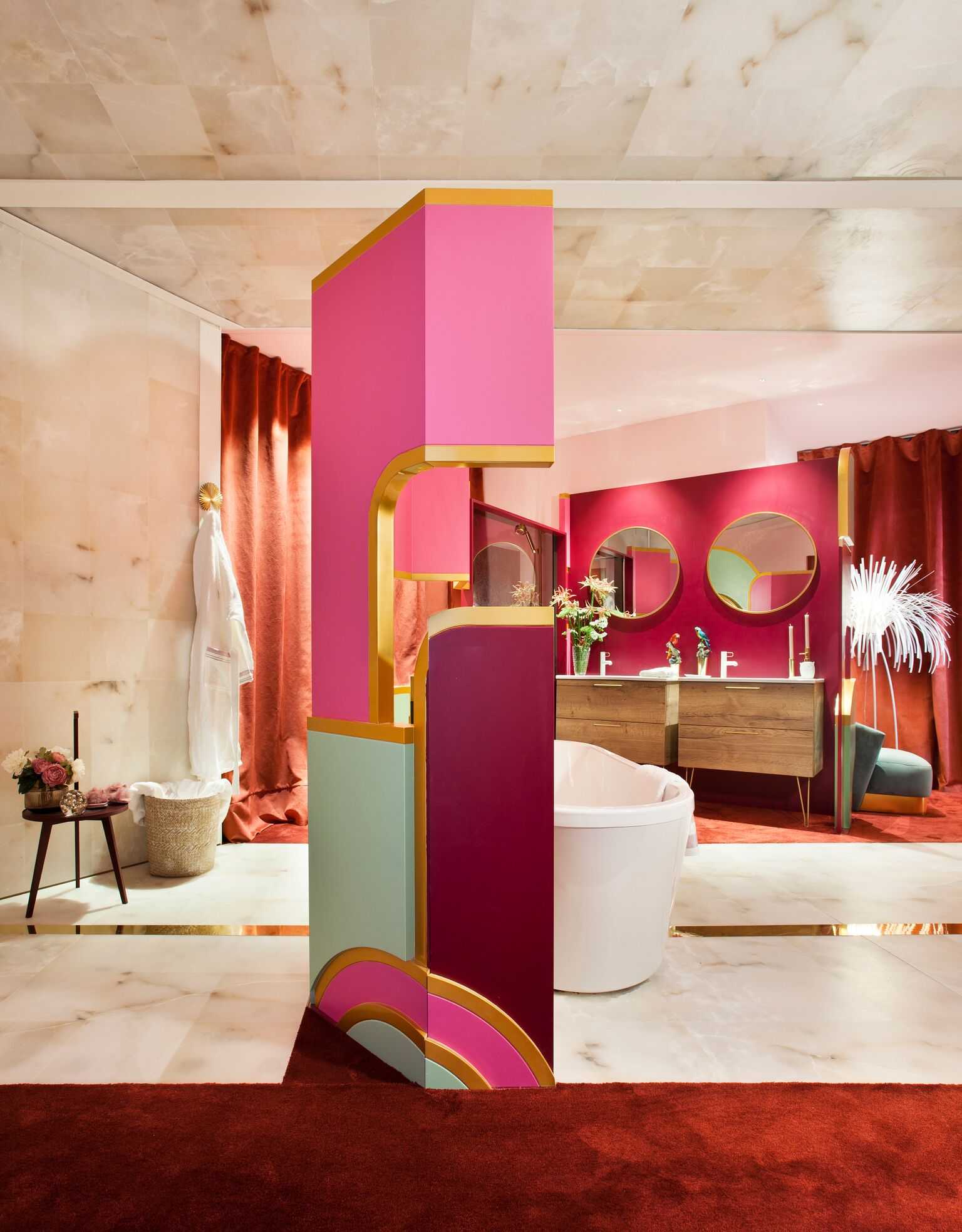 colourful bath design with pink, maroon and green colours with white bathtub, mirrors, brown cabinets and a table, designer bathroom wall tiles ideas