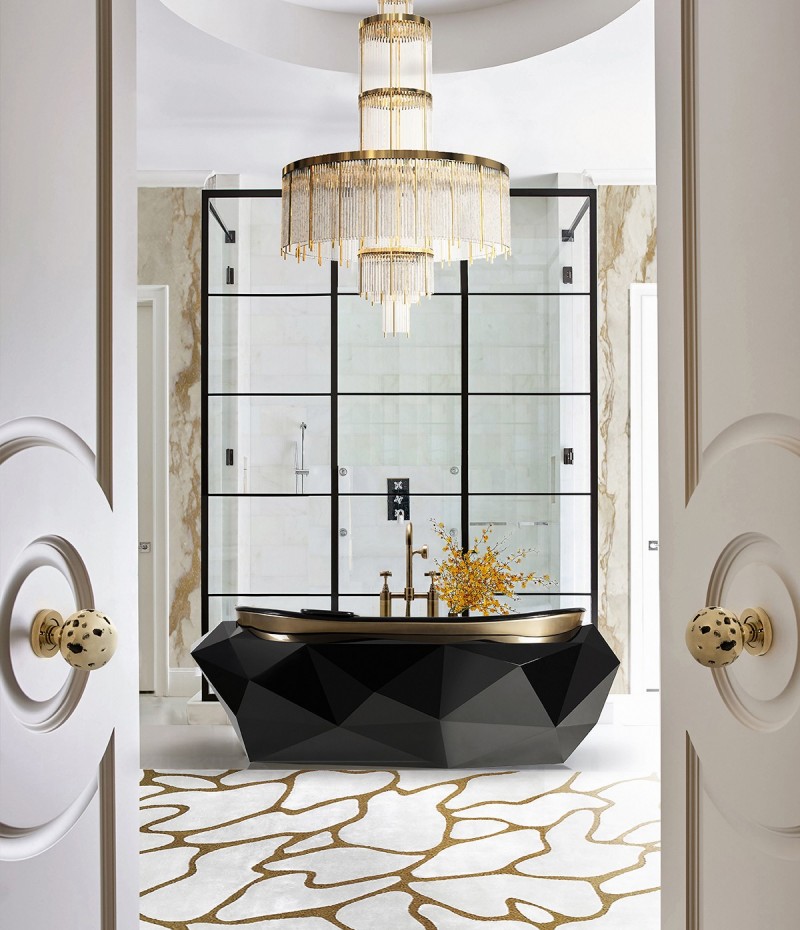 stunning bathroom with black bathtub, white floors, doors and a chandelier