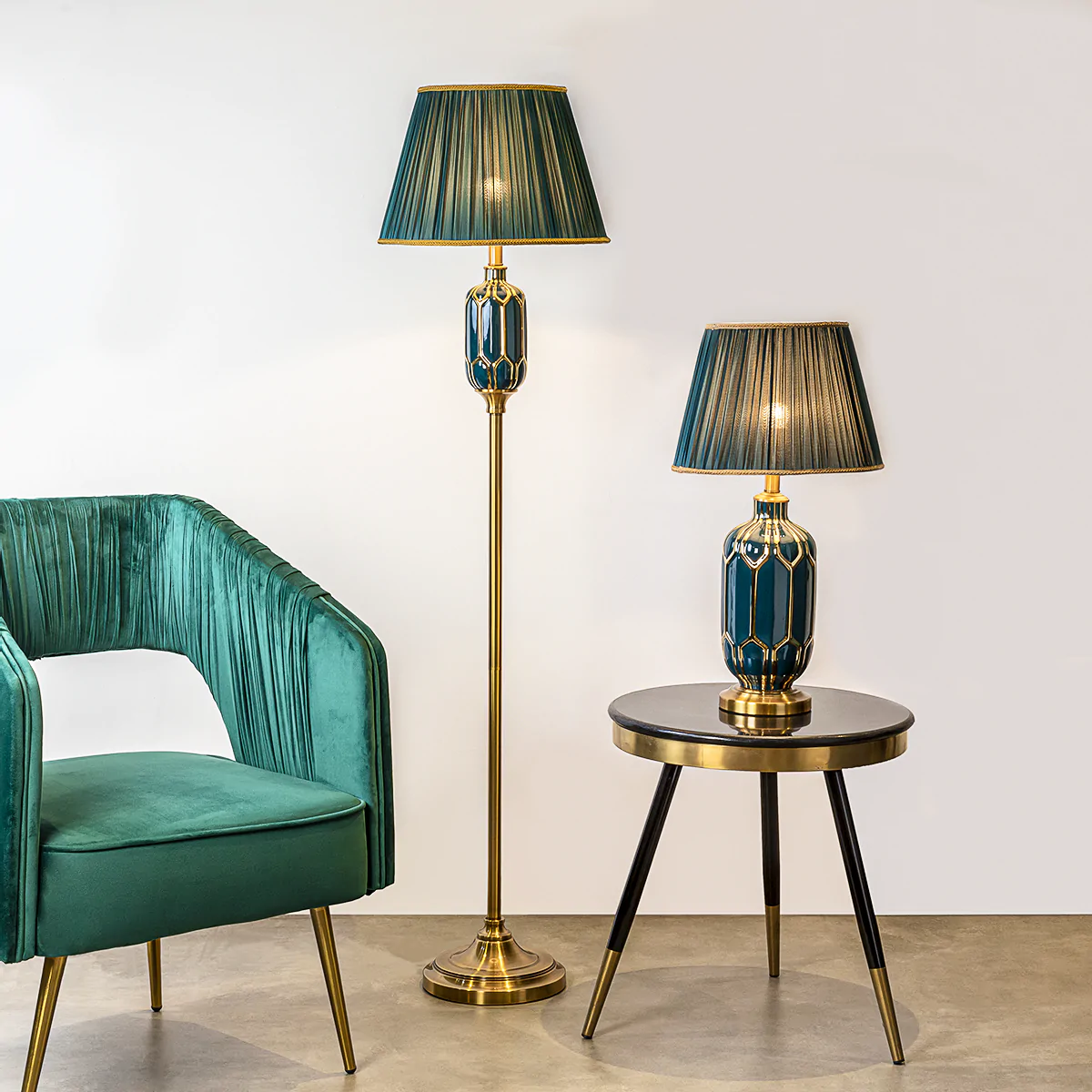an exquisite standing light for ،mes, with green shade giving a royal vibe, available online in many colours and styles just like uplighters, placed near an armchair, table lamp placed on side table, wooden flooring
