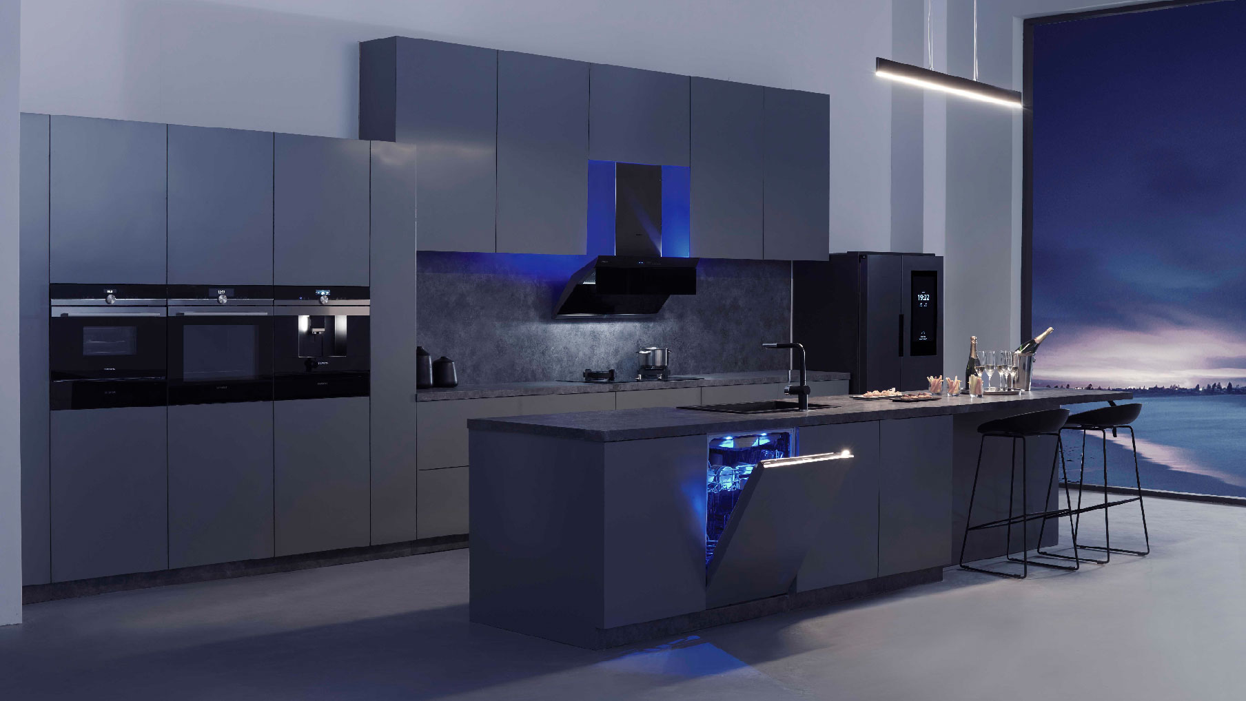 grey modern kitchen cupboards with chimney, built in appliances, fridge and kitchen island
