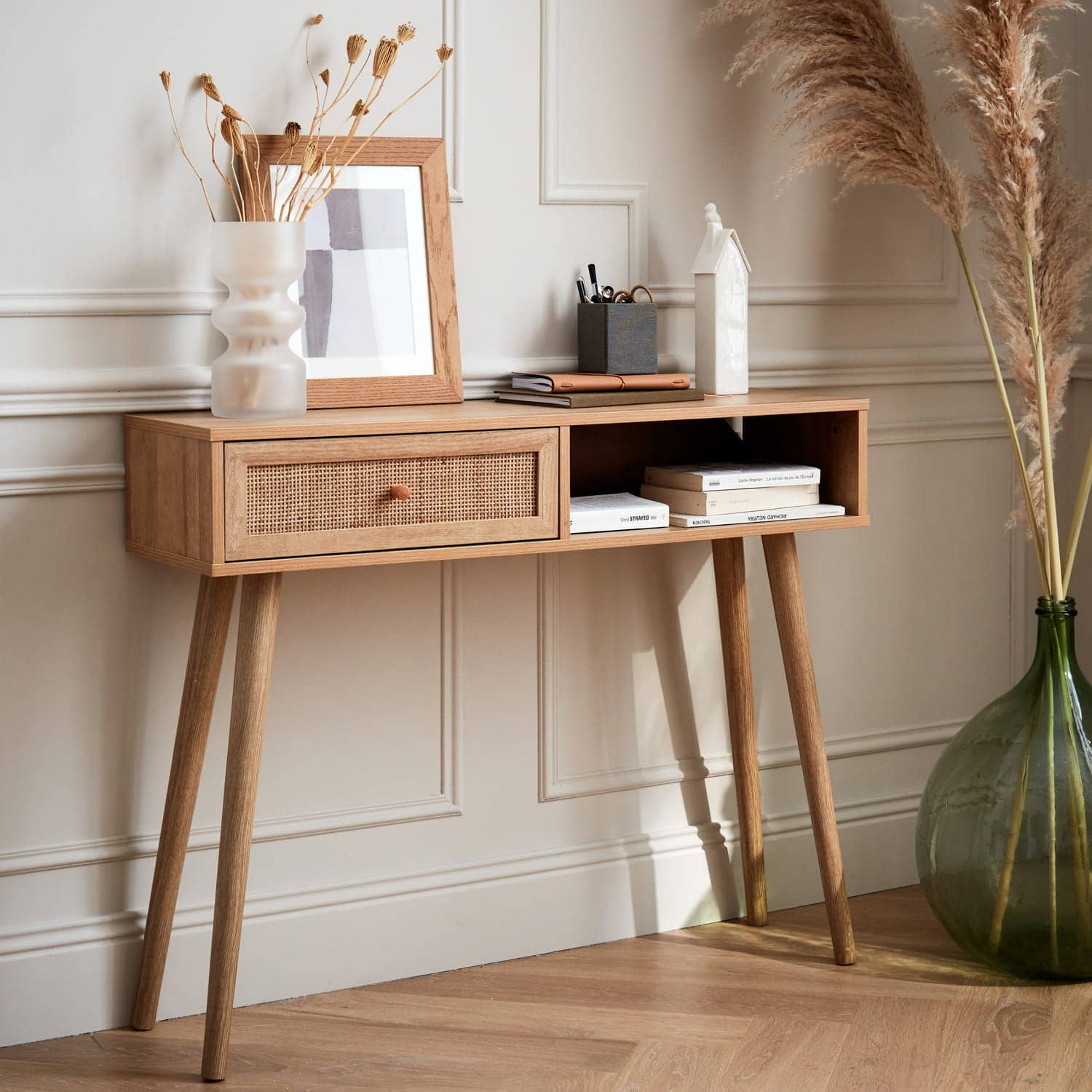 rattan sideboard, placed in living room for storage, has two drawers, wooden flooring