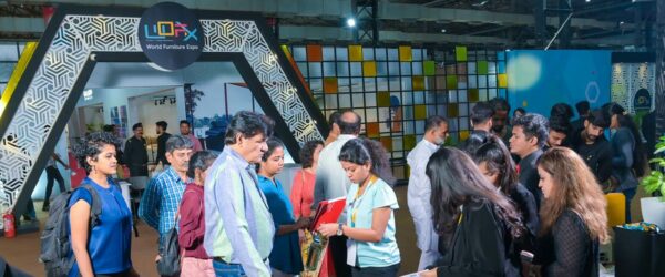 WOFX international furniture expo attended by mechants, manufacturers and buyers from the global market with a crowd of people at the entrance hall with brown flooring