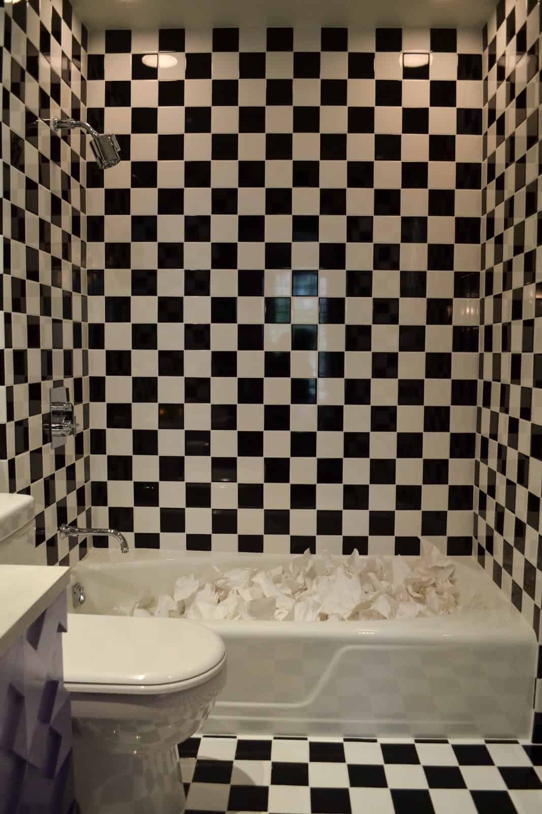 Checkerboard washroom wall tile design with similar floor and wall