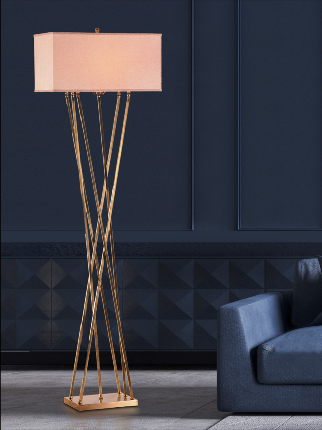 pink floor lamp in a living room with blue sofa