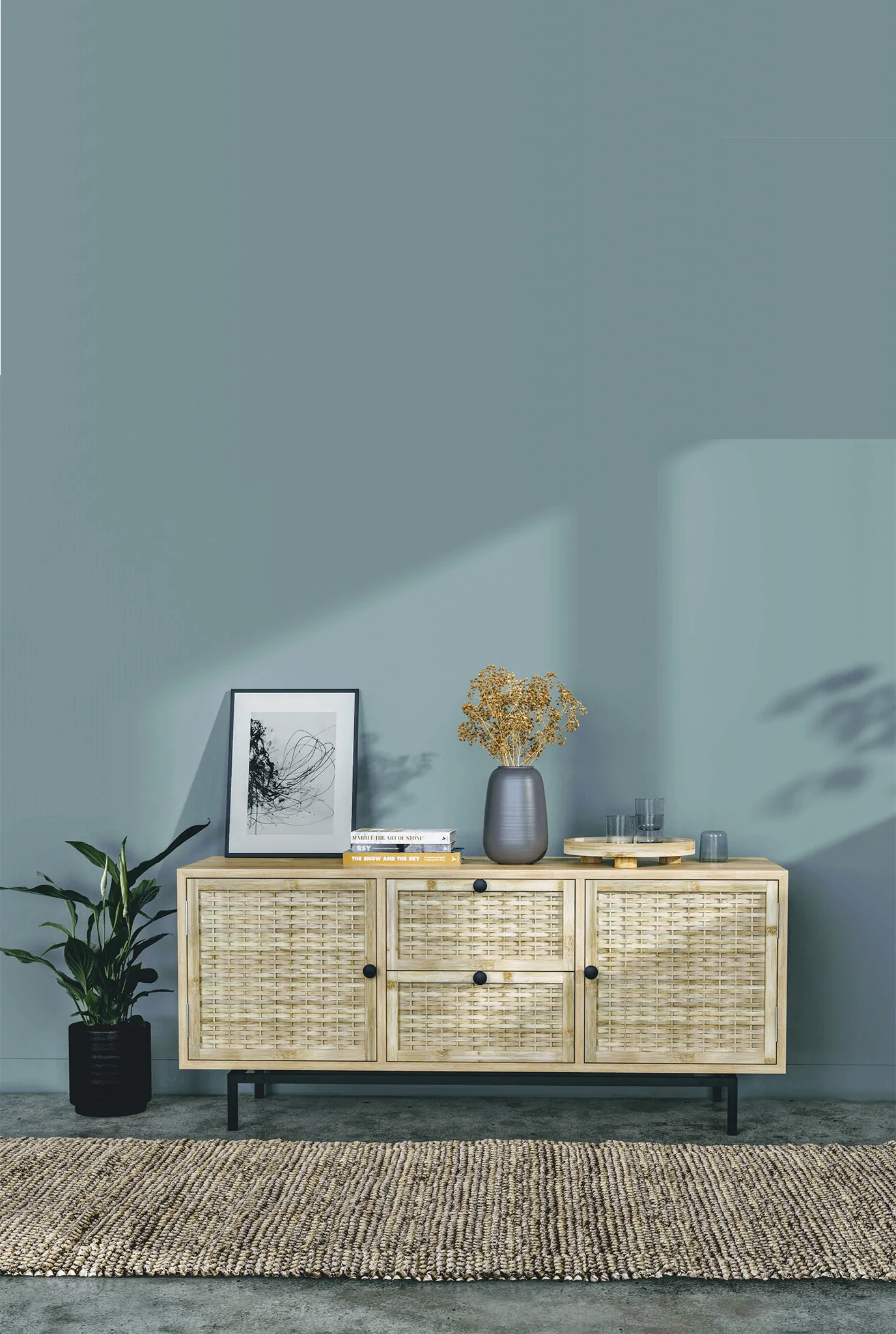 rattan console table, placed in living room, indoor planter beside the table