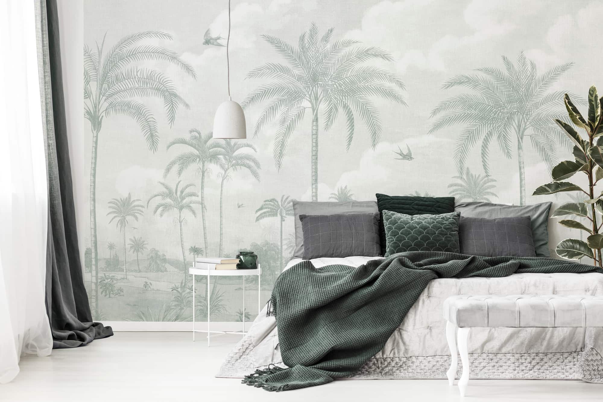 palm tree prints on wallpaper giving a natural touch to your decor, hanging light hanged over the bed, minimal bed room decor