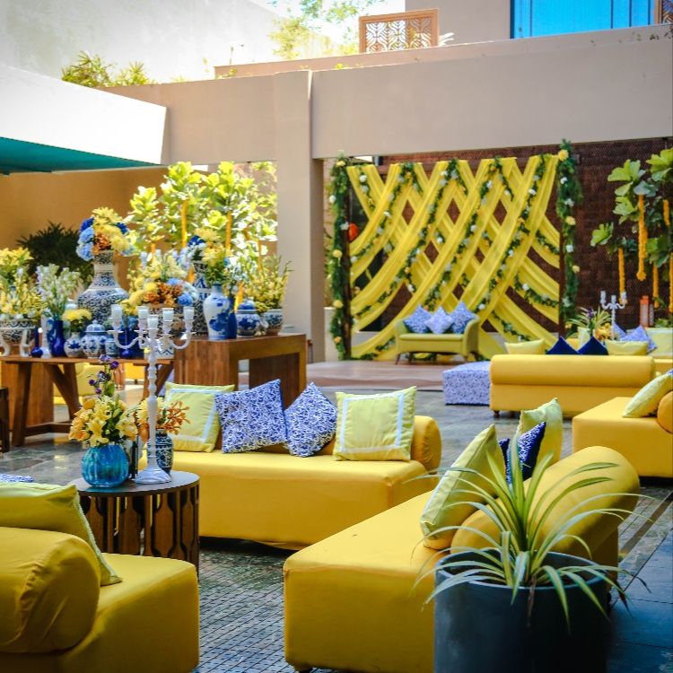 Indoor seating and a vibrant Haldi decoration theme