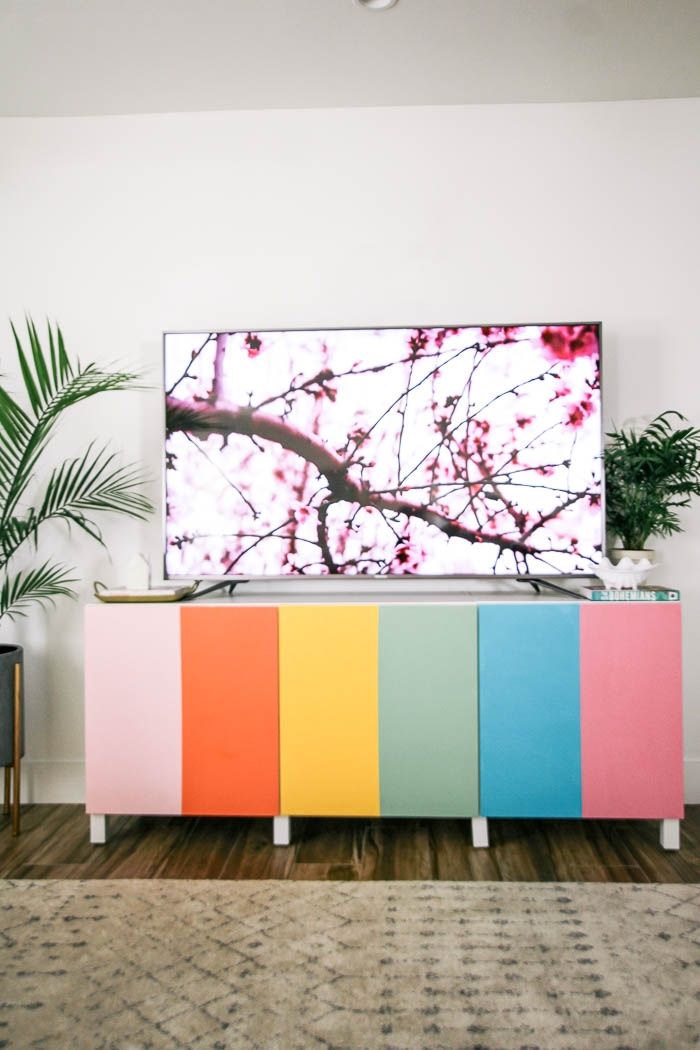 A colourful tv cabinet with tv