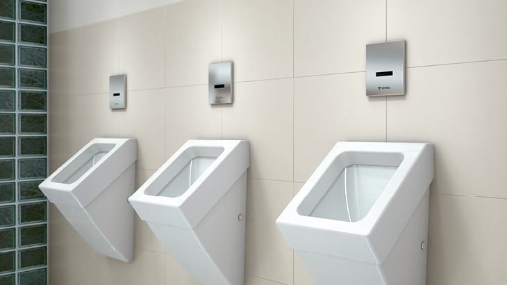 white washroom with white toilets in silver flushes 