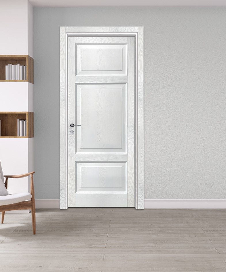 white wooden door in a living room with a brown chair and shelf