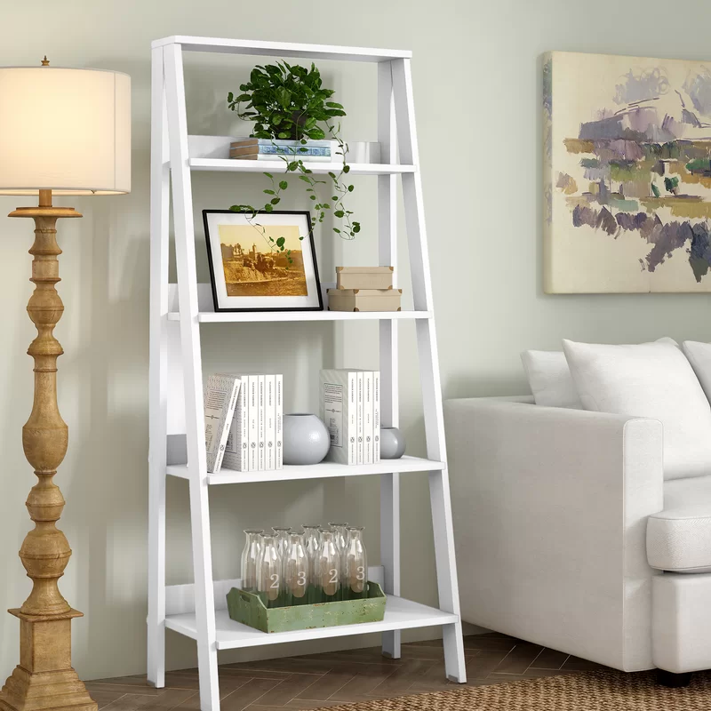 White coloured ladder s،wcase for your living room with p،to frames, books, and other collectibles on it