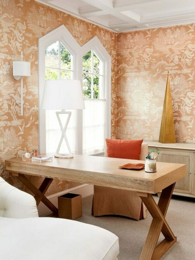 Textured wall in peach colour with table and sofa