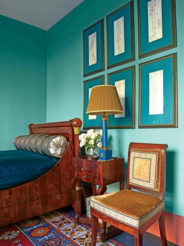 Teal blue wall with a chair