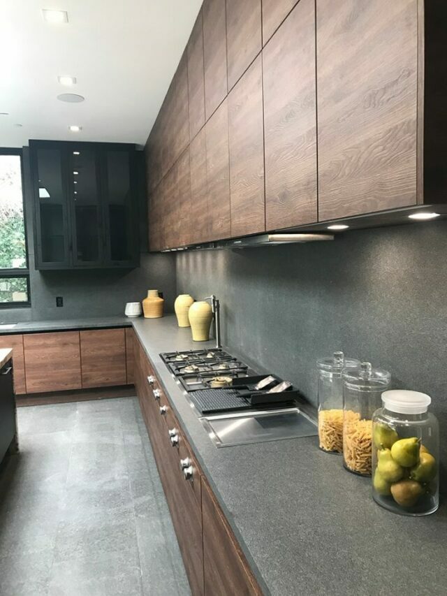 A contemporary kitchen with grey countertop