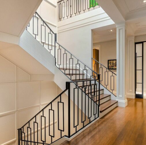 Staircase with black railing