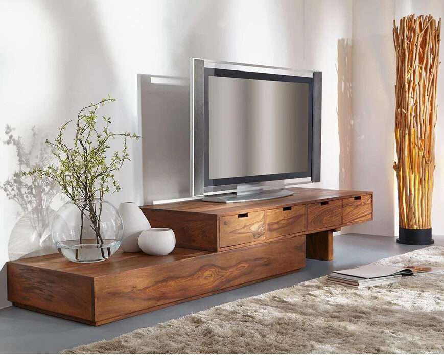 A lavish tv unit with a tv and plant