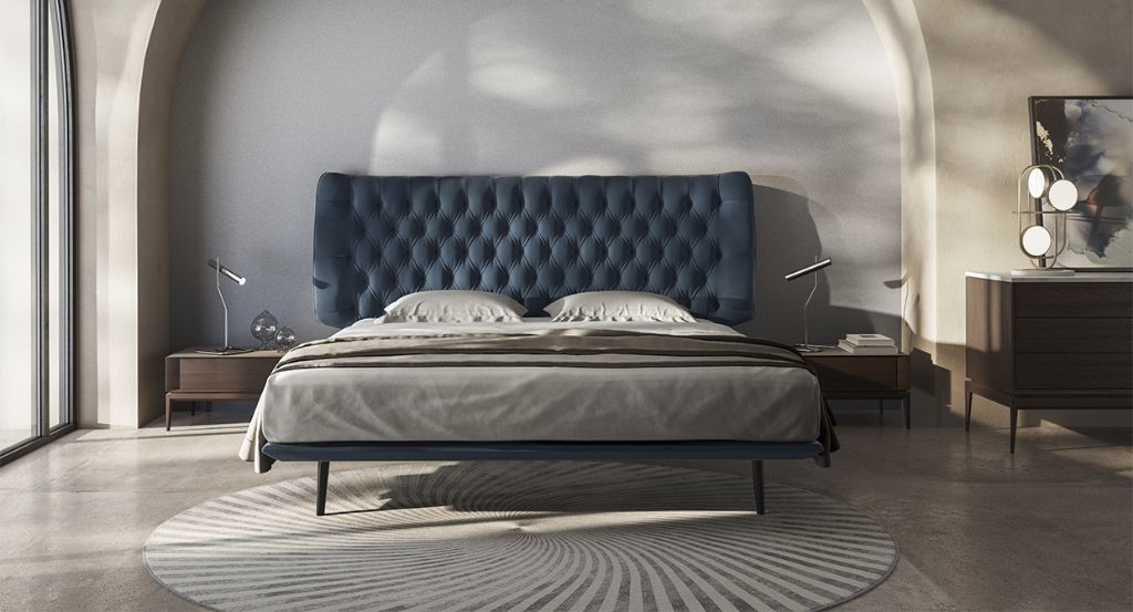 white bedroom with a modern wood double bed design, brown table, table lamp and a rug