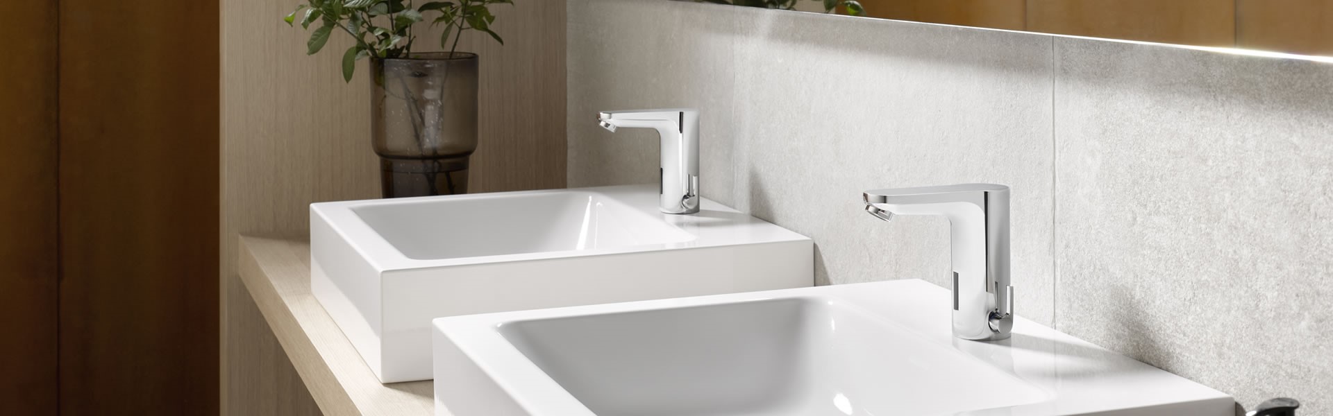 silver tap in a washroom with white washbasin